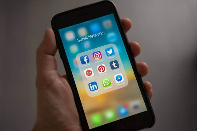 social media apps on a smartphone screen social media policy