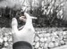 black and white image of hand holding a cigarette
